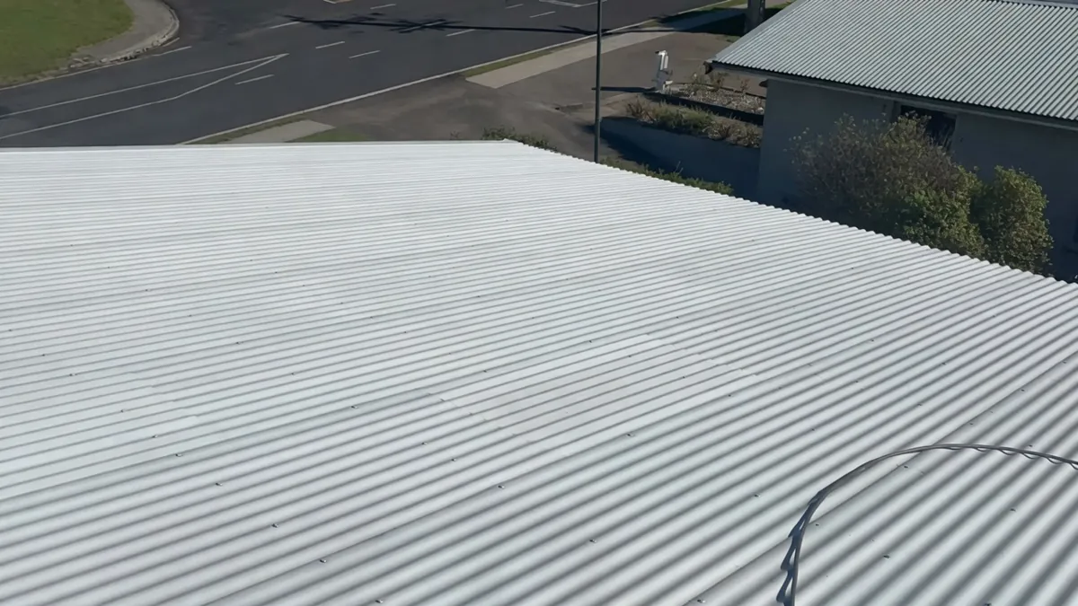 Primer and rust treatment applied to corrugated iron roof in Pukehangi