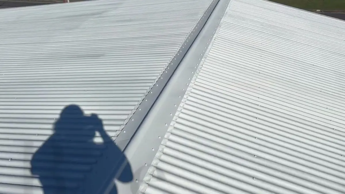 First protective coat applied to restored corrugated iron roof