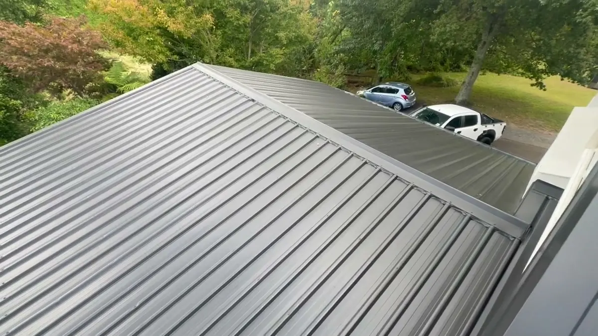 Standalone garage corrugated roof restored and finished in Flaxpod to match the house